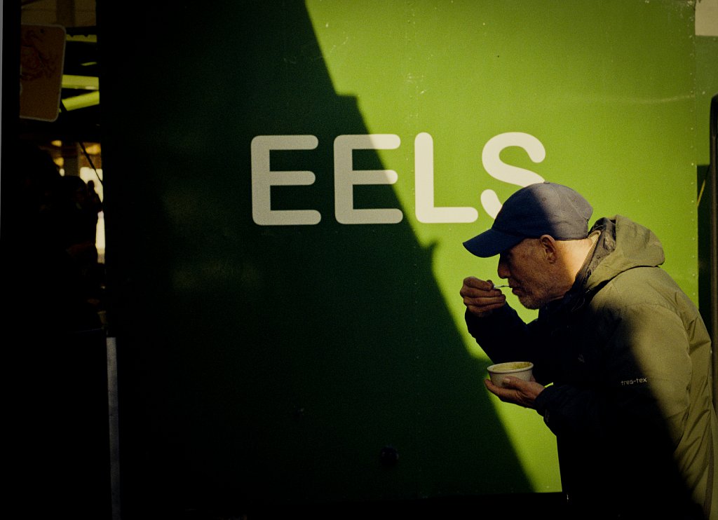  A customer  at Gary Salmon's  pie & peas stall on its last day of trading  the old market. The stall has been trading since 1946 and will close when the market moves to a new area in the town.